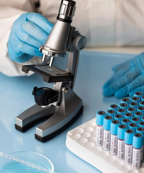 doctor-analyzing-blood-samples-with-microscope